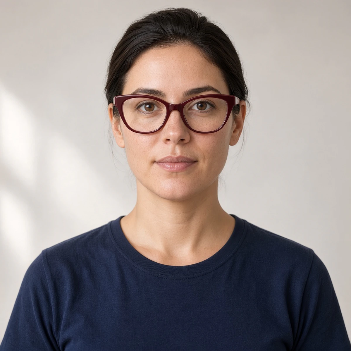 Sample portrait wearing burgundy cat-eye glasses