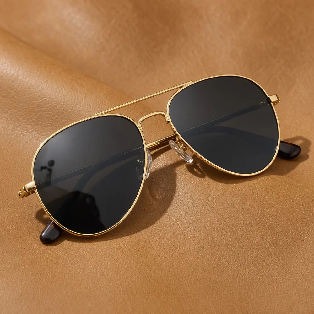 Gold aviator sunglasses with a double bridge and dark teardrop lenses