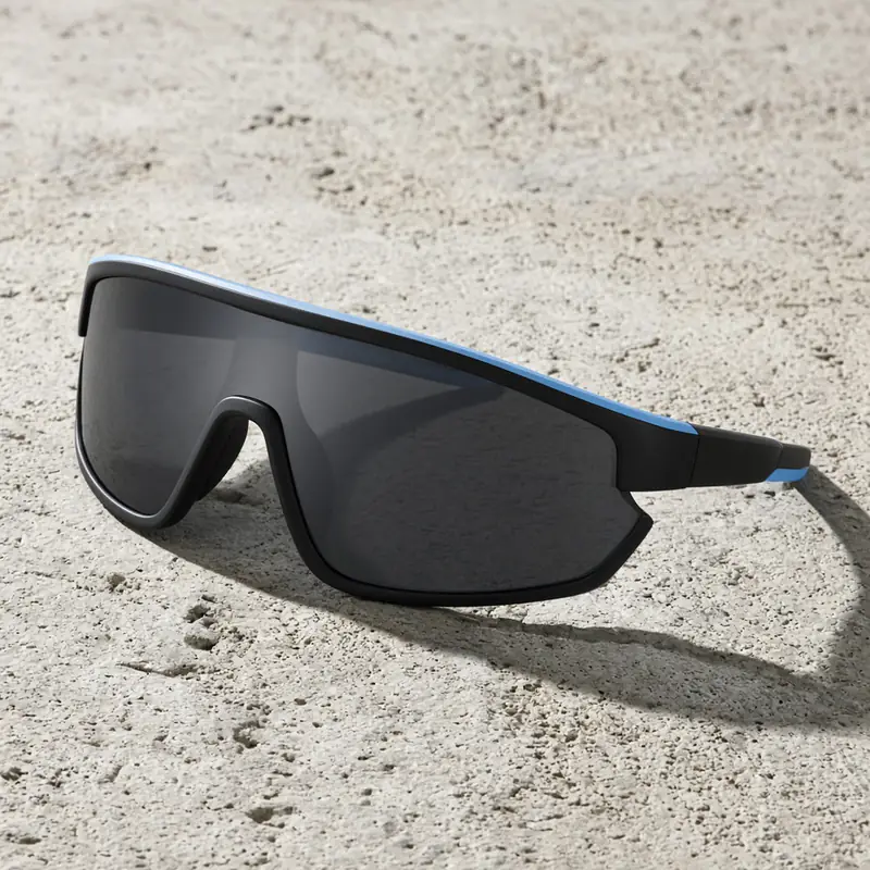 Sport wraparound sunglasses with a single wide shield lens